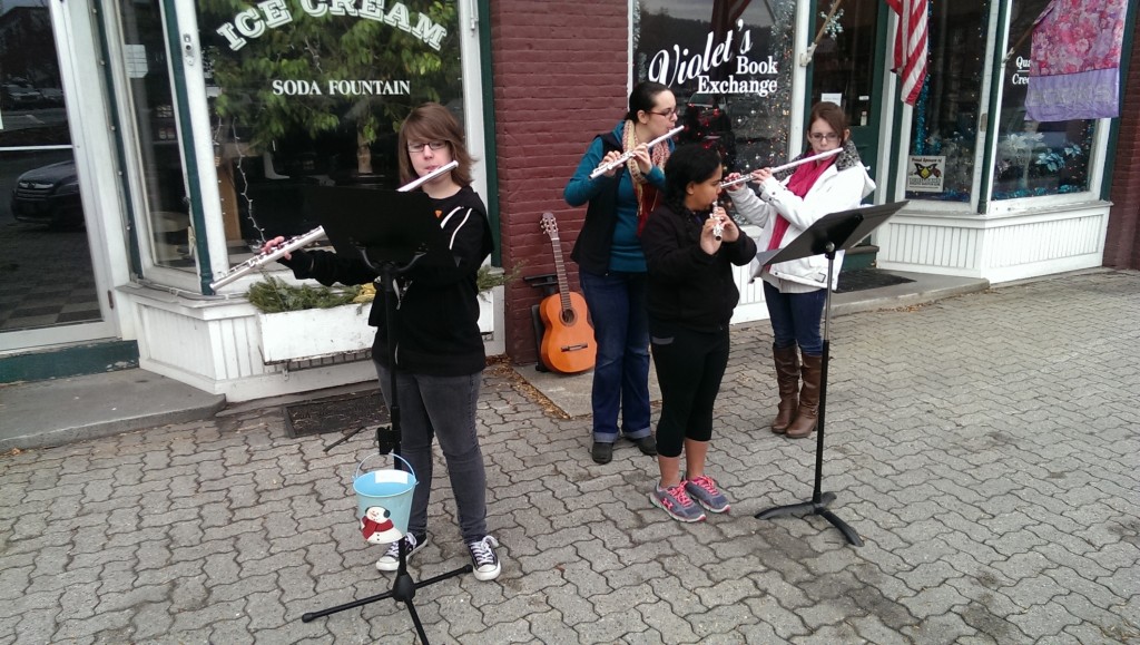 a few students and faculty from the West Claremont Center for Music and the Arts walked around downtown Claremont spreading holiday cheer through music and carols. They visited Pathway's participants during their lunch at Trinity Church, the Post Office, Revolution Cantina, outside Violet's Bookstore, and Stone Arch Bakery. Students included Riley McFarland, Mariauna King, and Hayley Valdivia. Faculty included Angela Biggs, Chris Cheon, and Melissa Richmond